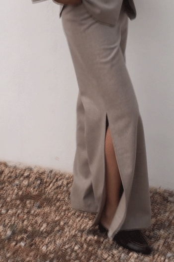 The Lena Wide-Leg Wool Trousers with side slit in beige